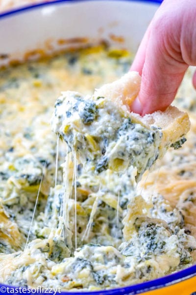 crostini bread in spinach artichoke dip