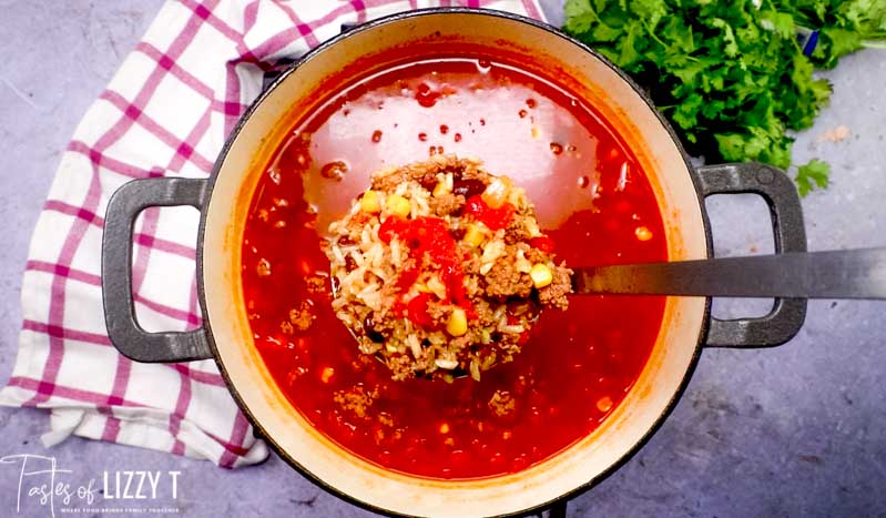 mexican rice soup in a ladle