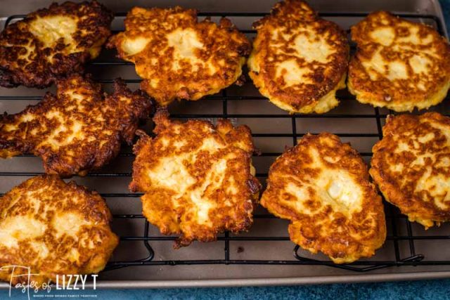 fried potato cakes on a wire rack