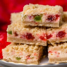 merry cherry bars stacked on a plate