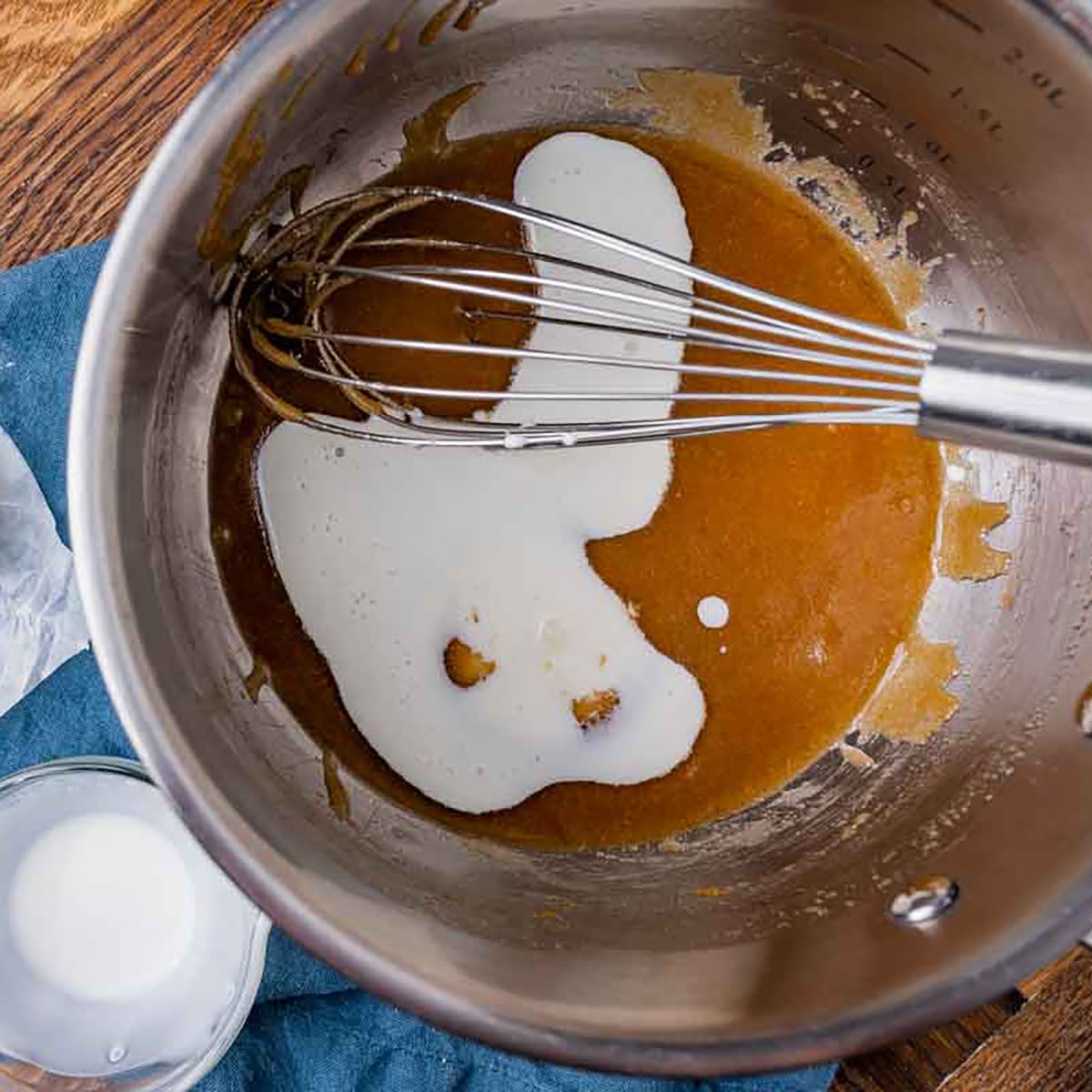 heavy cream in brown sugar in a saucepan