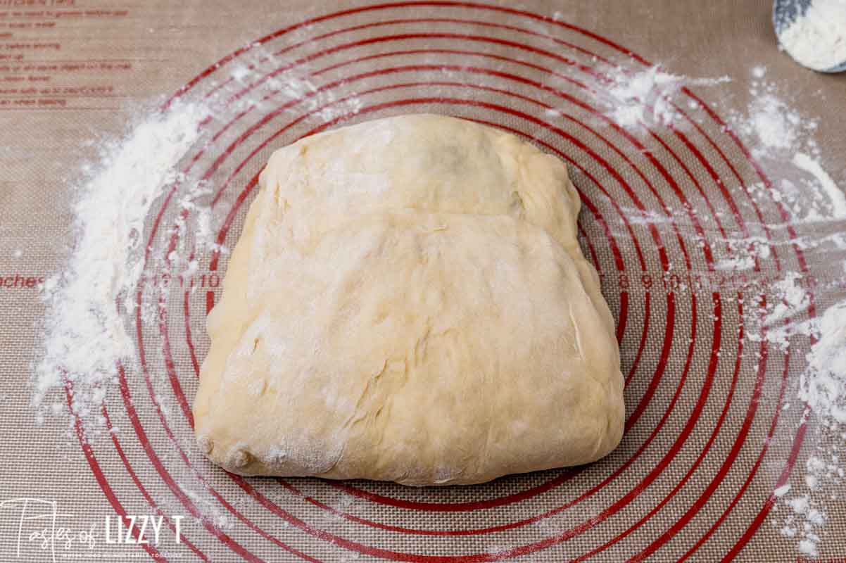 ball of dough on a baking mat