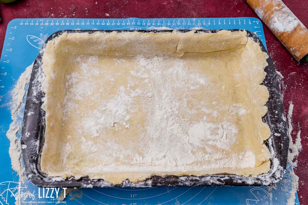 pie dough stretched in a 9x13 pan