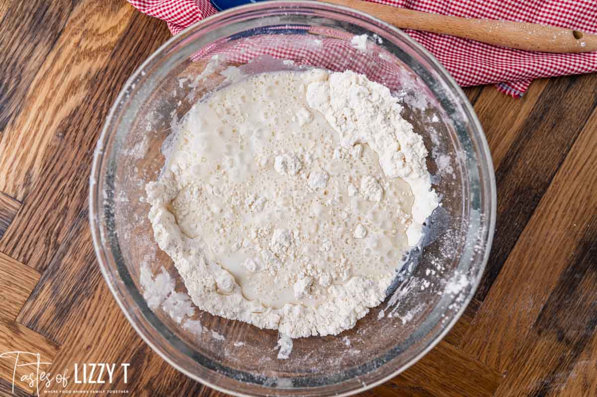 flour and butter with milk over it in a bowl