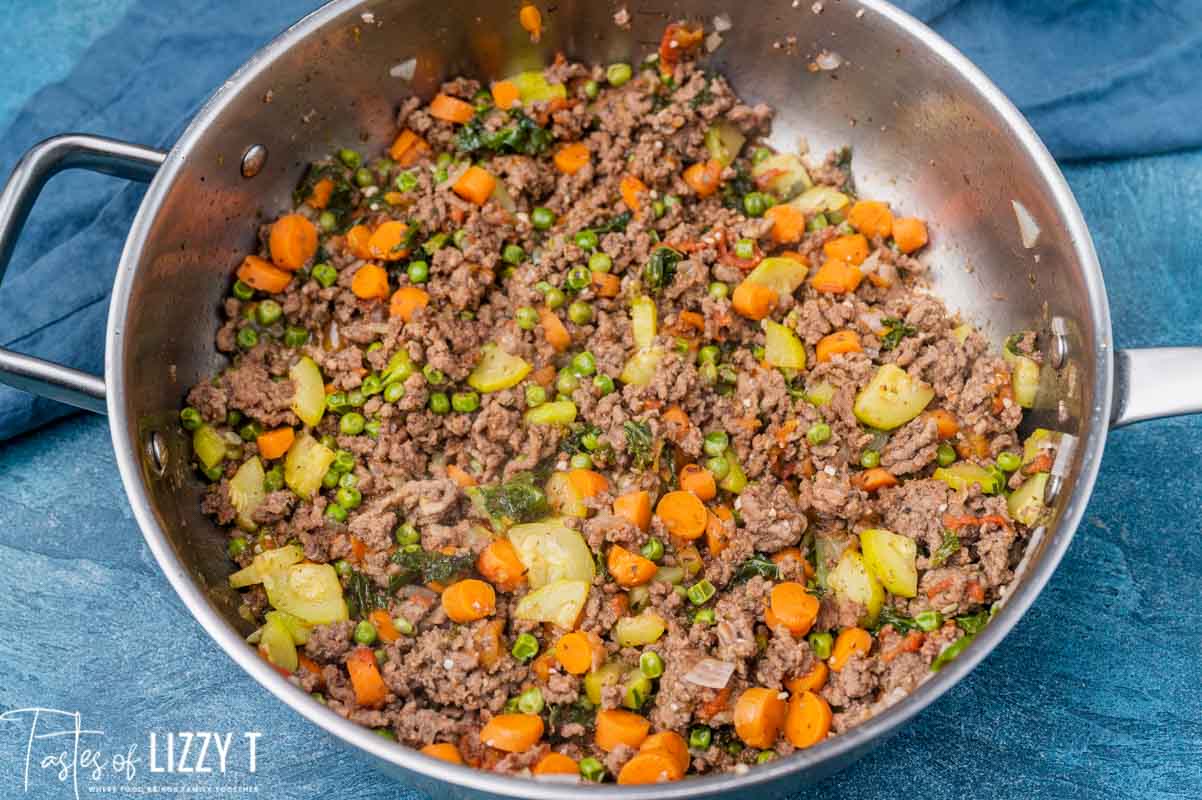 ground beef with sauteed veggies in a skillet