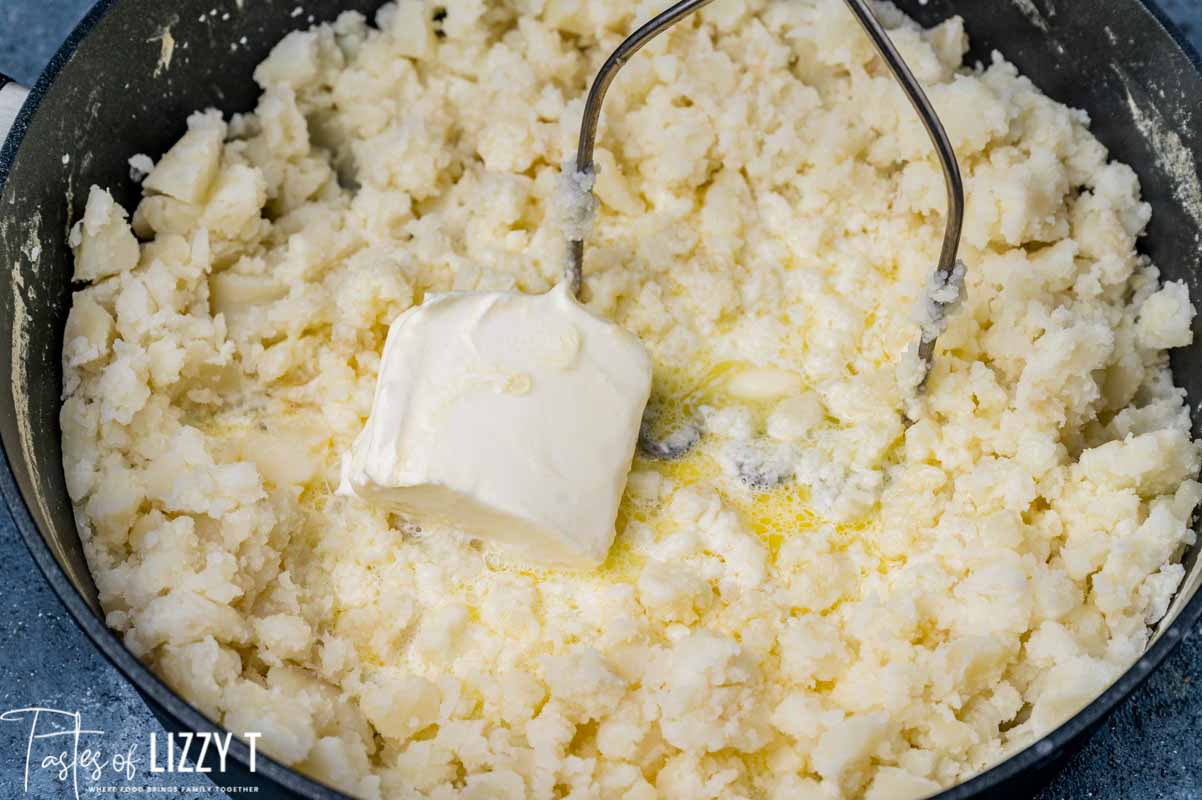 potatoes in a pan with butter and cream cheese