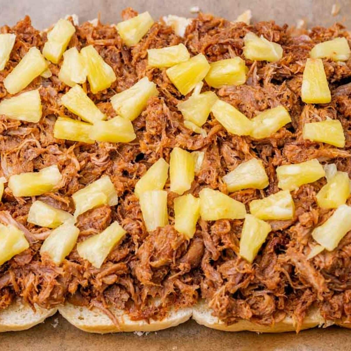 pineapple tidbits on pulled pork for sliders