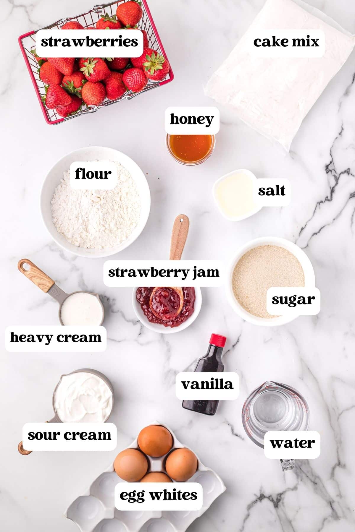 ingredients for strawberry shortcake cupcakes on a table