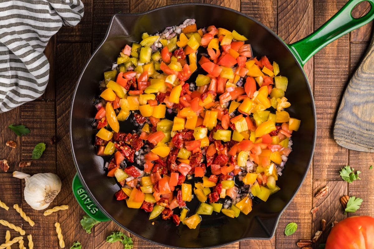 peppers, sundried tomatoes in a skillet