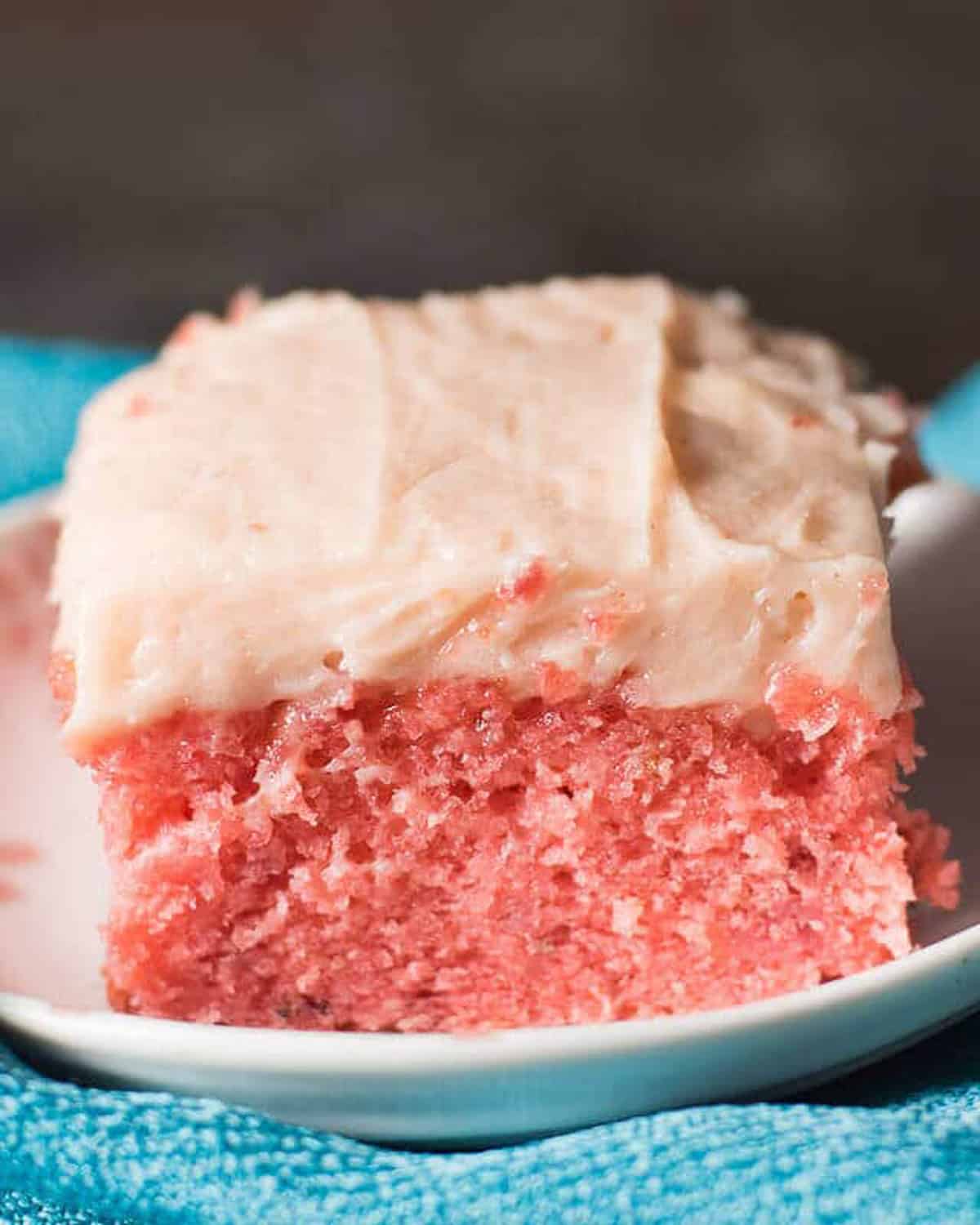 a piece of strawberry cake on a plate