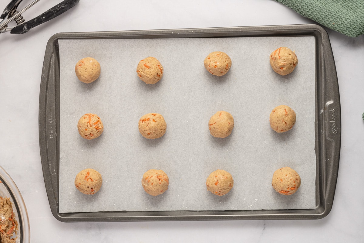 unbaked carrot cookies on a baking sheet