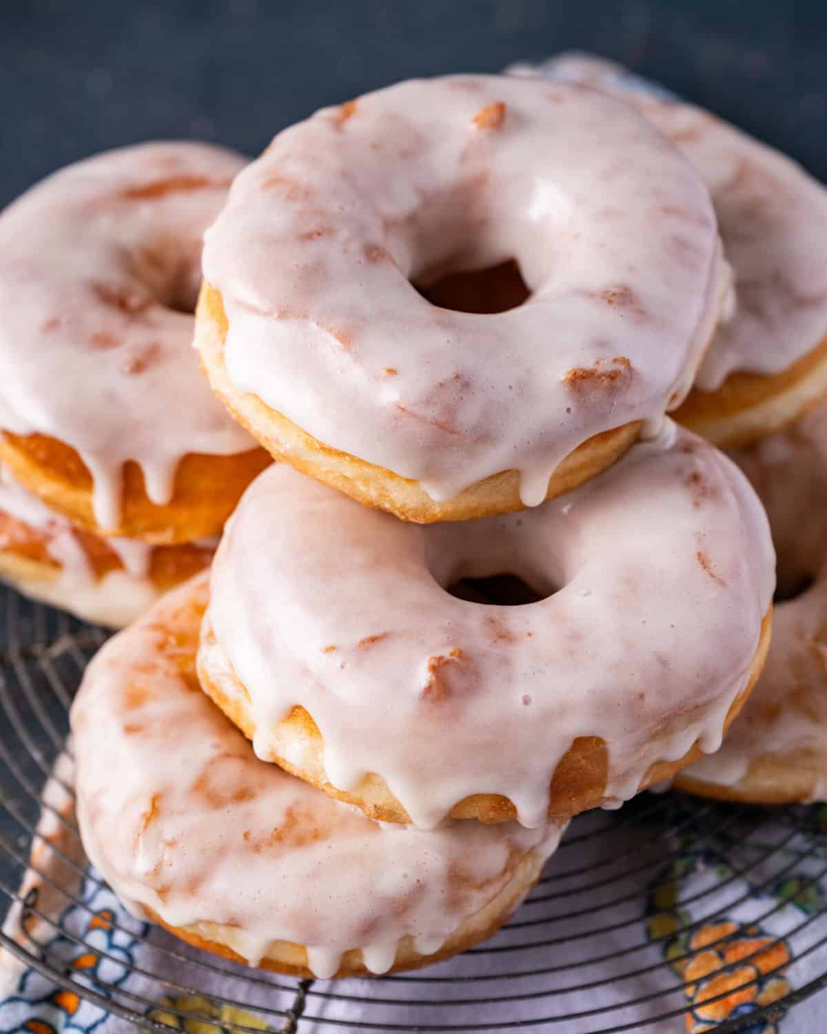 a stack of vanilla glazed amish donuts