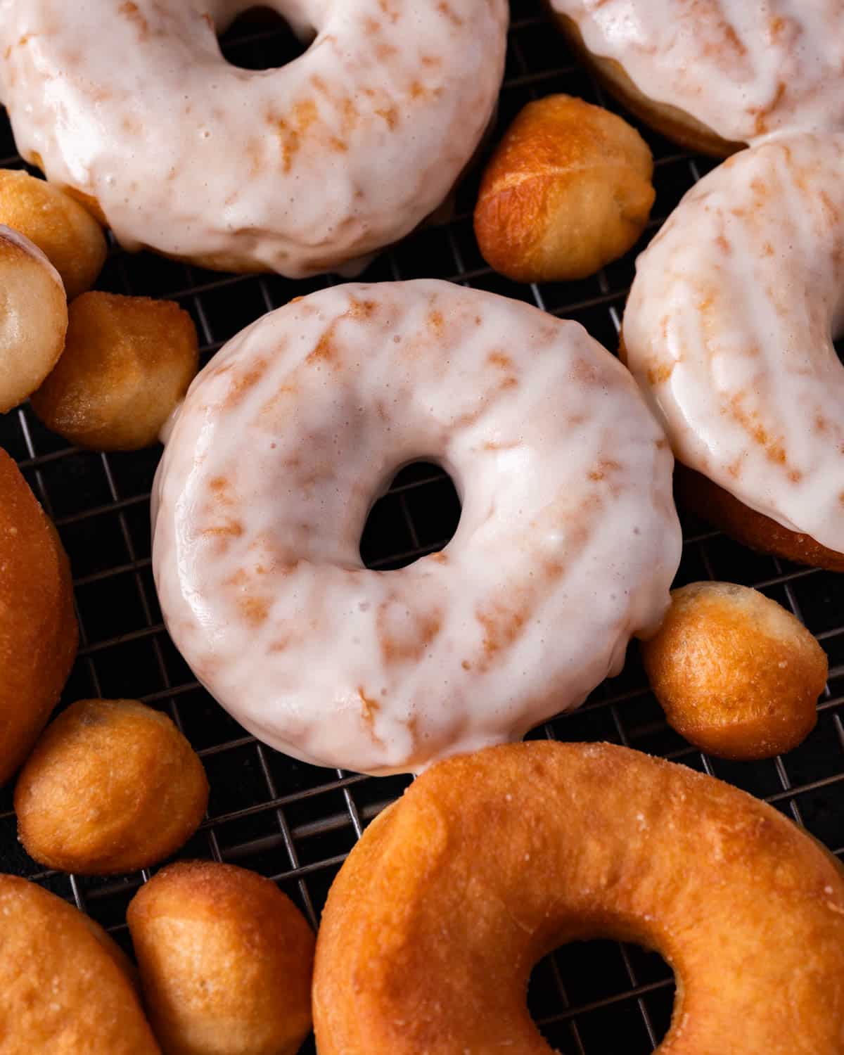 overhead view of amish glazed donuts on a wire rack