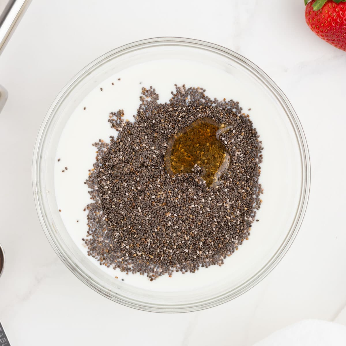 chia, milk and honey in a bowl