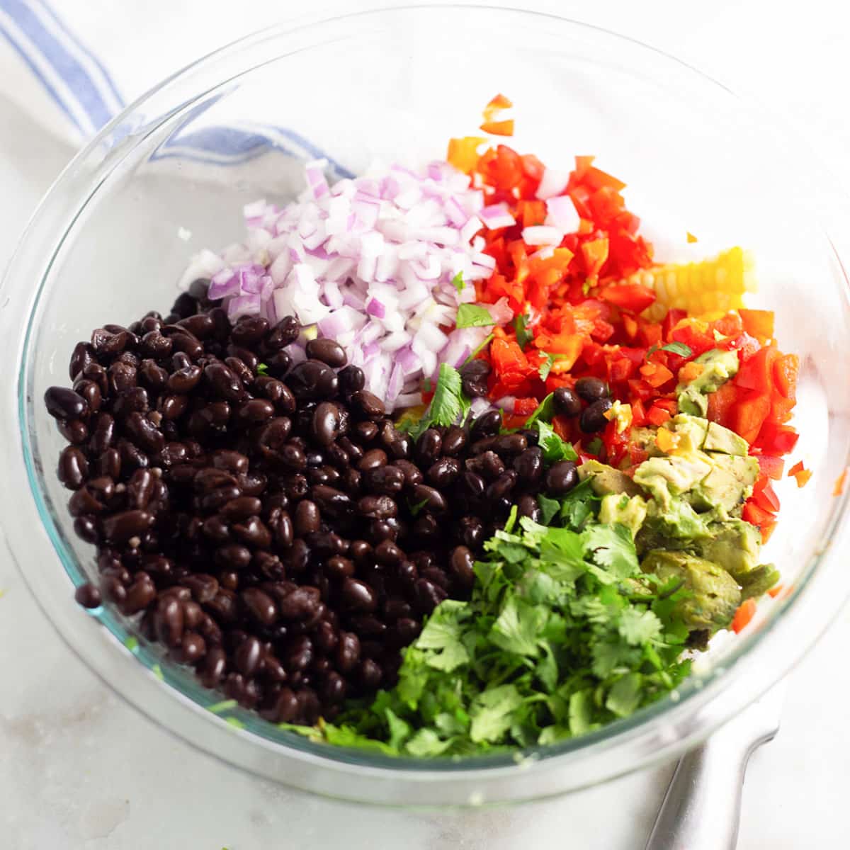 ingredients for black bean salad in a bowl