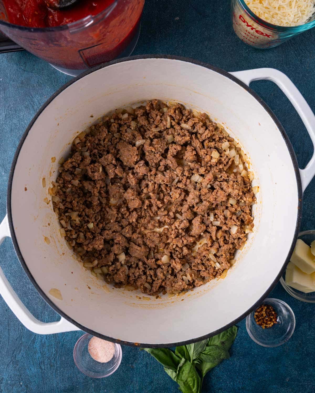 browned sausage and onions in a skillet