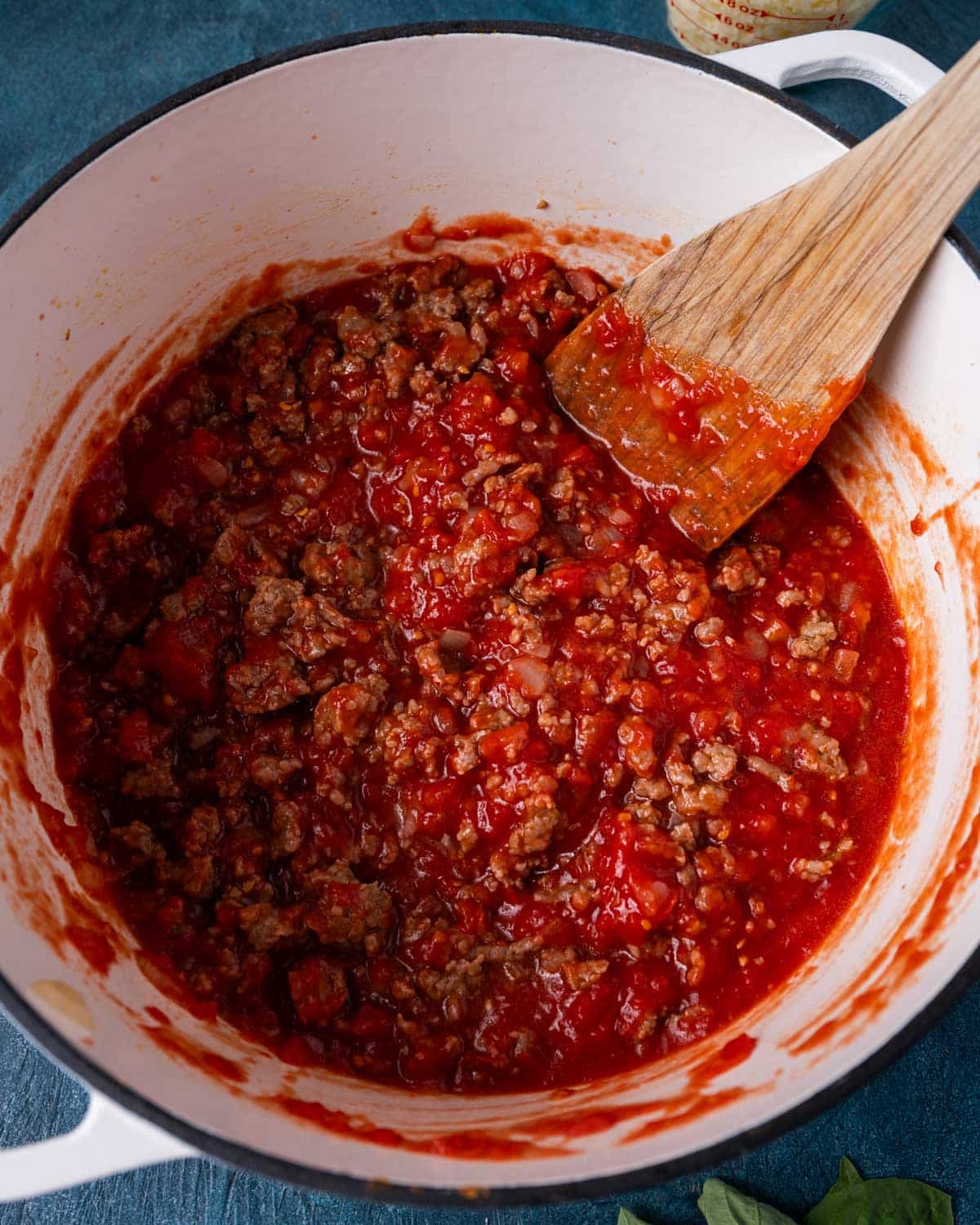 tomato sauce and sausage in a skillet