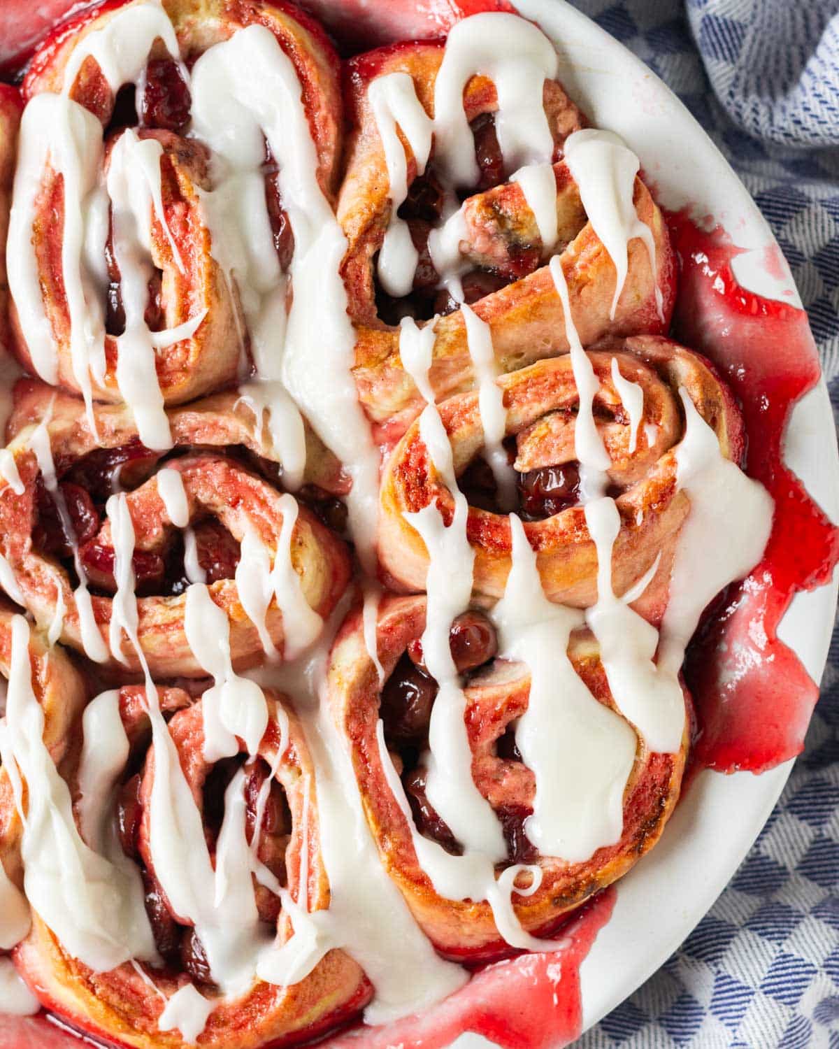 overhead view of cherry rolls in a white pan