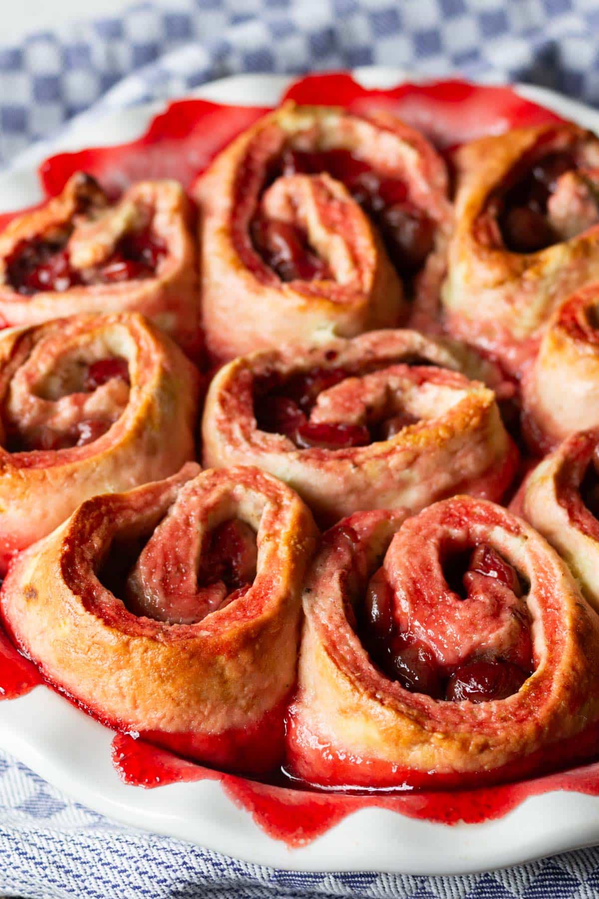 cherry sweet rolls in a baking pan