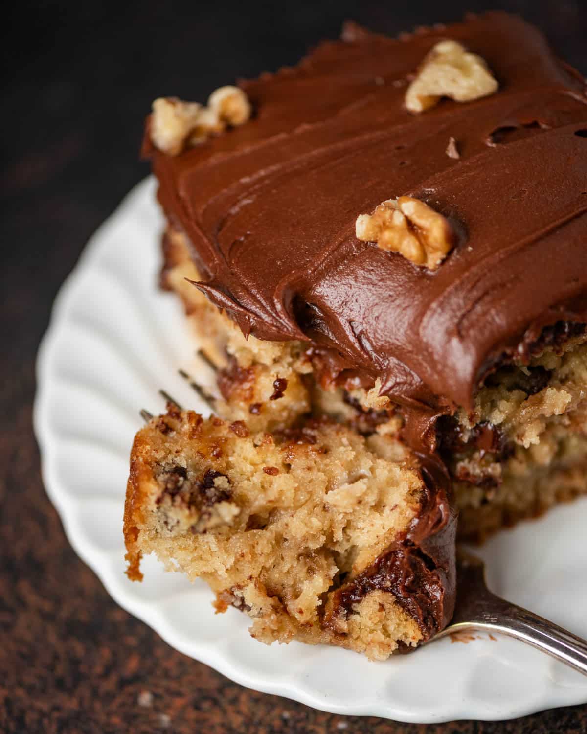 a piece of chocolate chip cookie cake on a plate with a fork