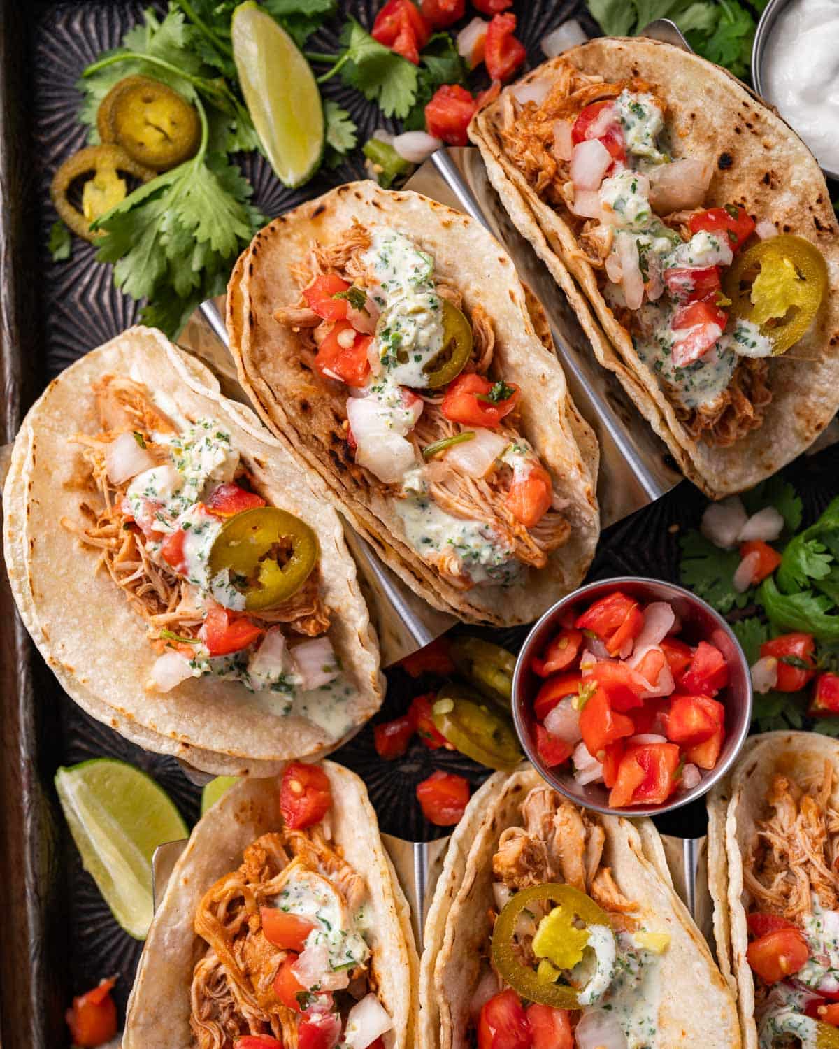 overhead view of chicken tacos on a serving platter