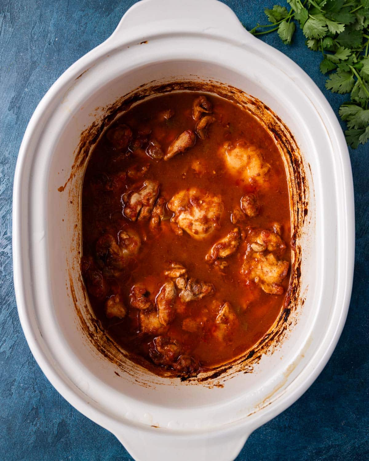 overhead view of chicken in a crockpot