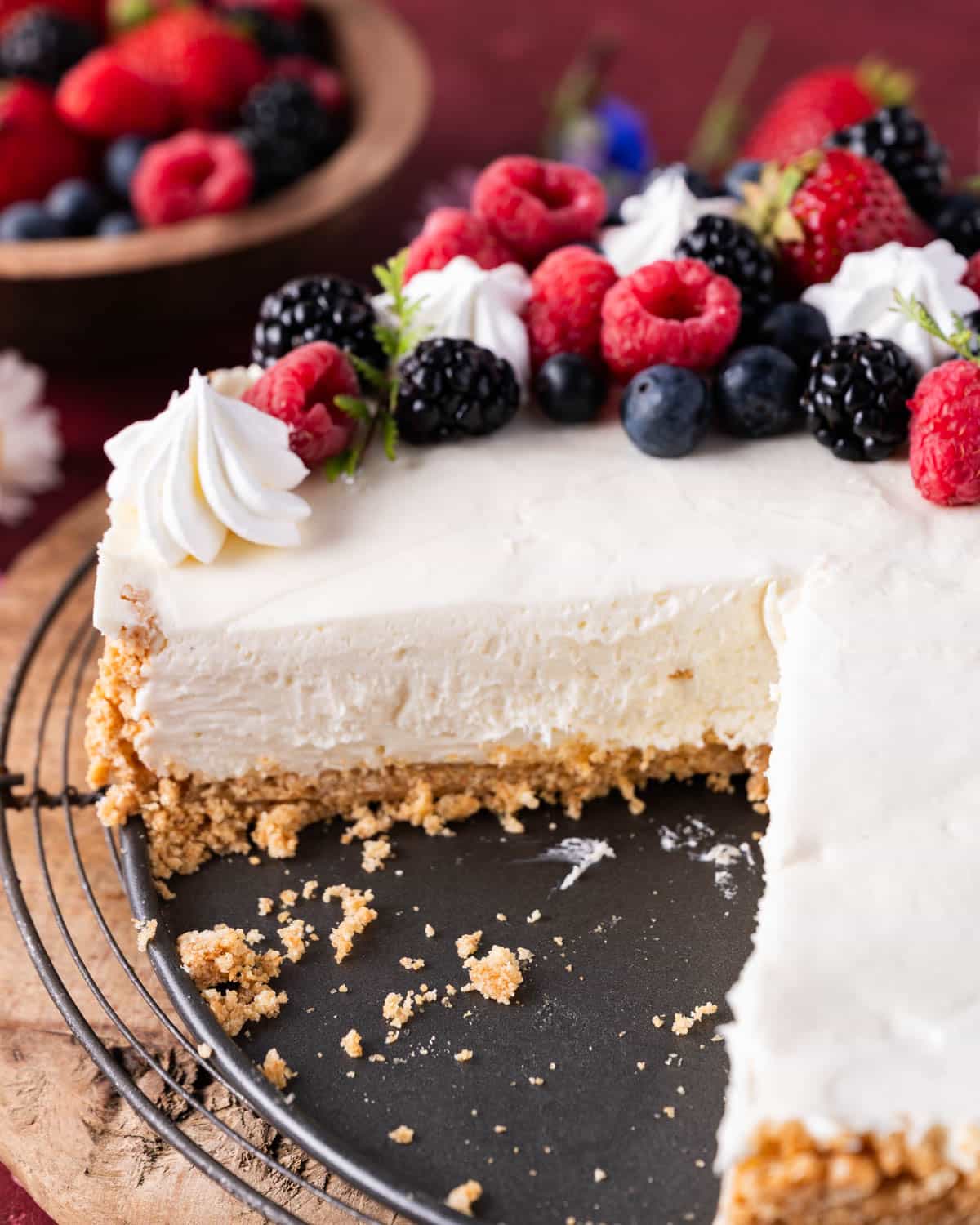 a creamy no bake cheesecake with a slice cut out of it