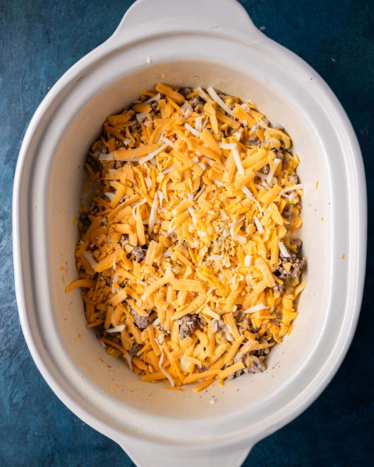 pasta, ground beef and cheese in a slow cooker