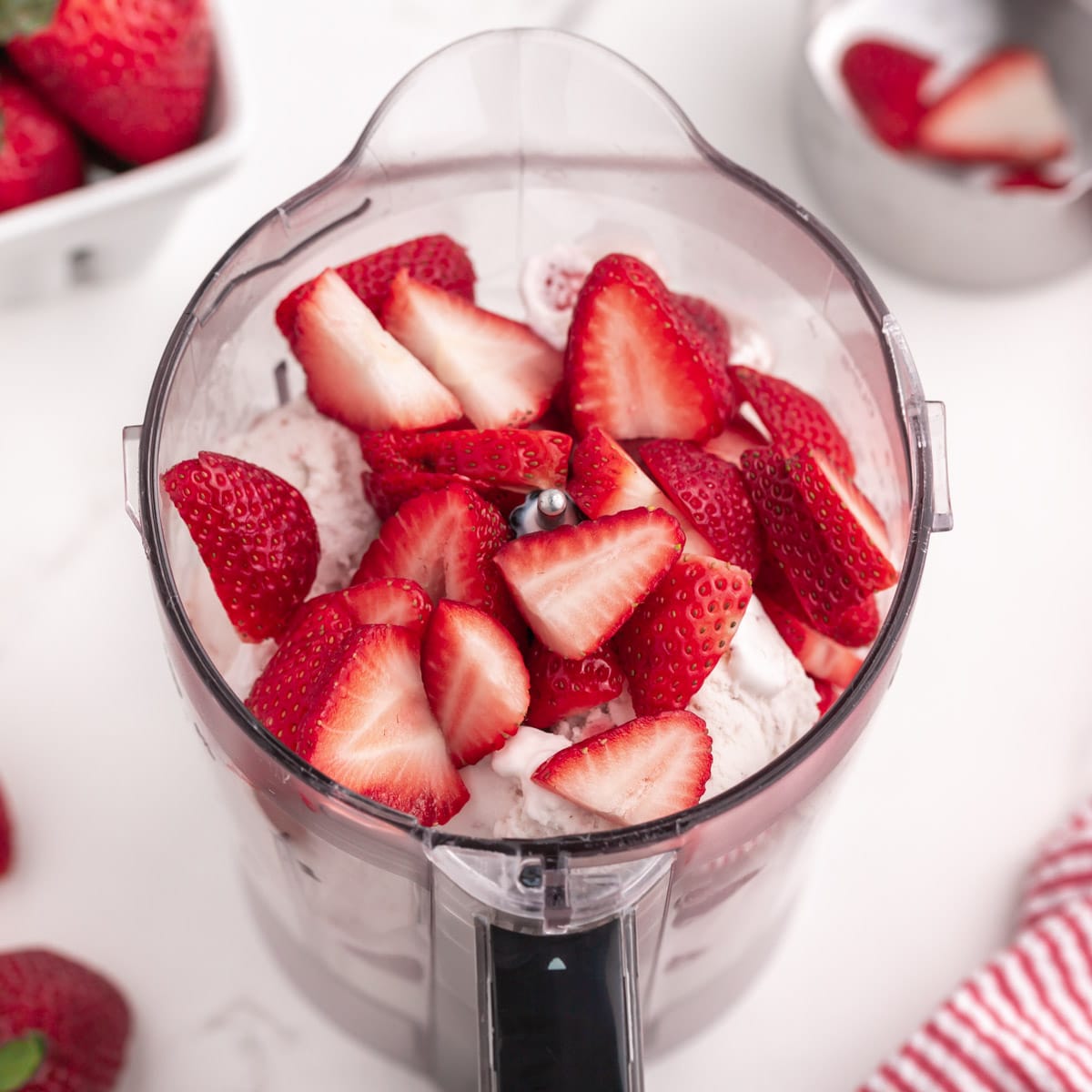 ice cream and strawberries in a blender