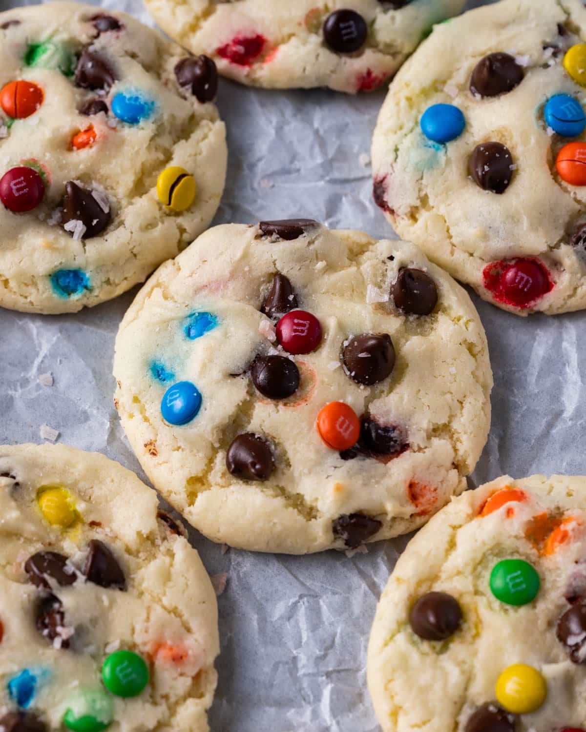 cake mix cookies with m&ms and chocolate chips on parchment paper