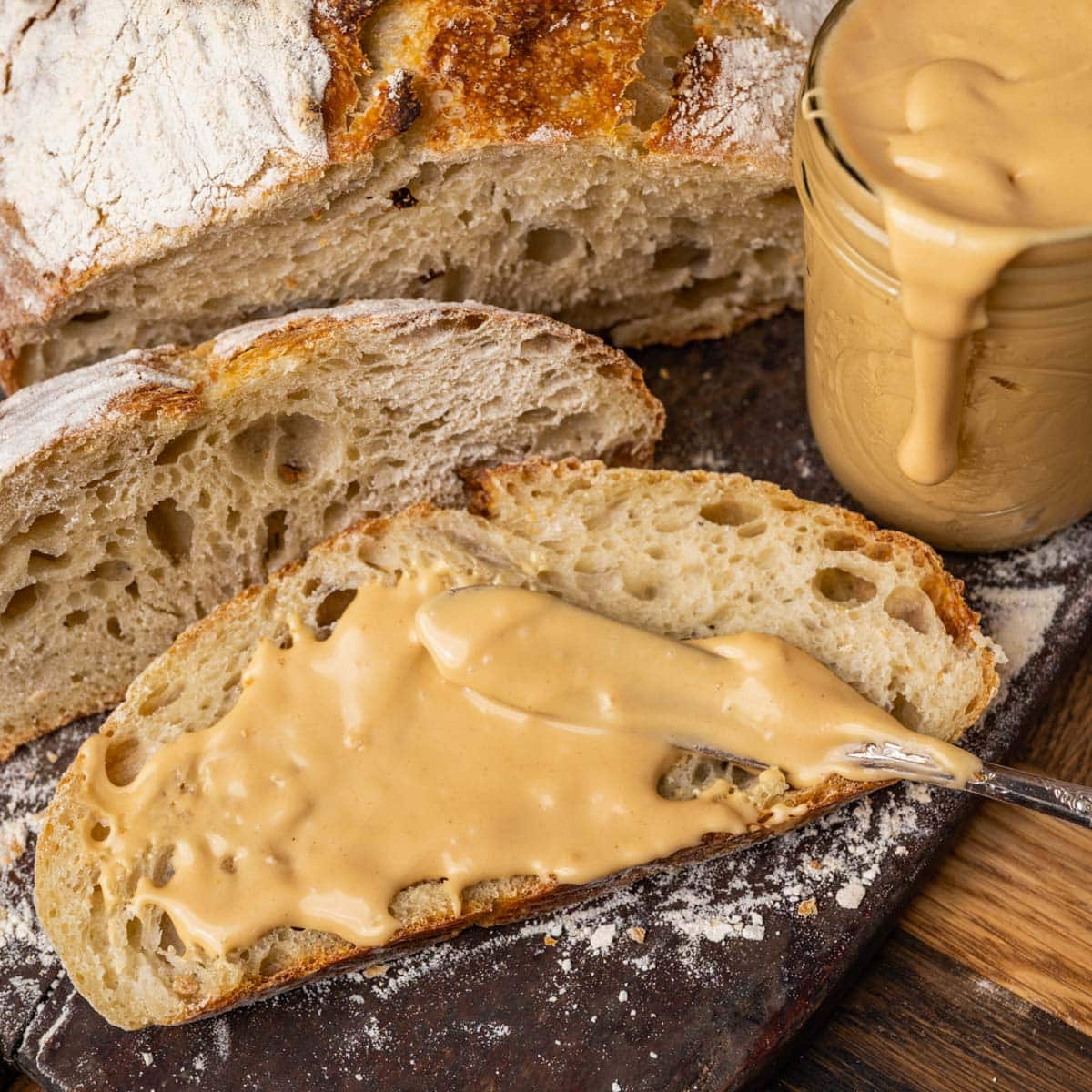 spreading peanut butter on a slice of bread