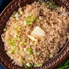 closeup of stick of butter rice in a bowl