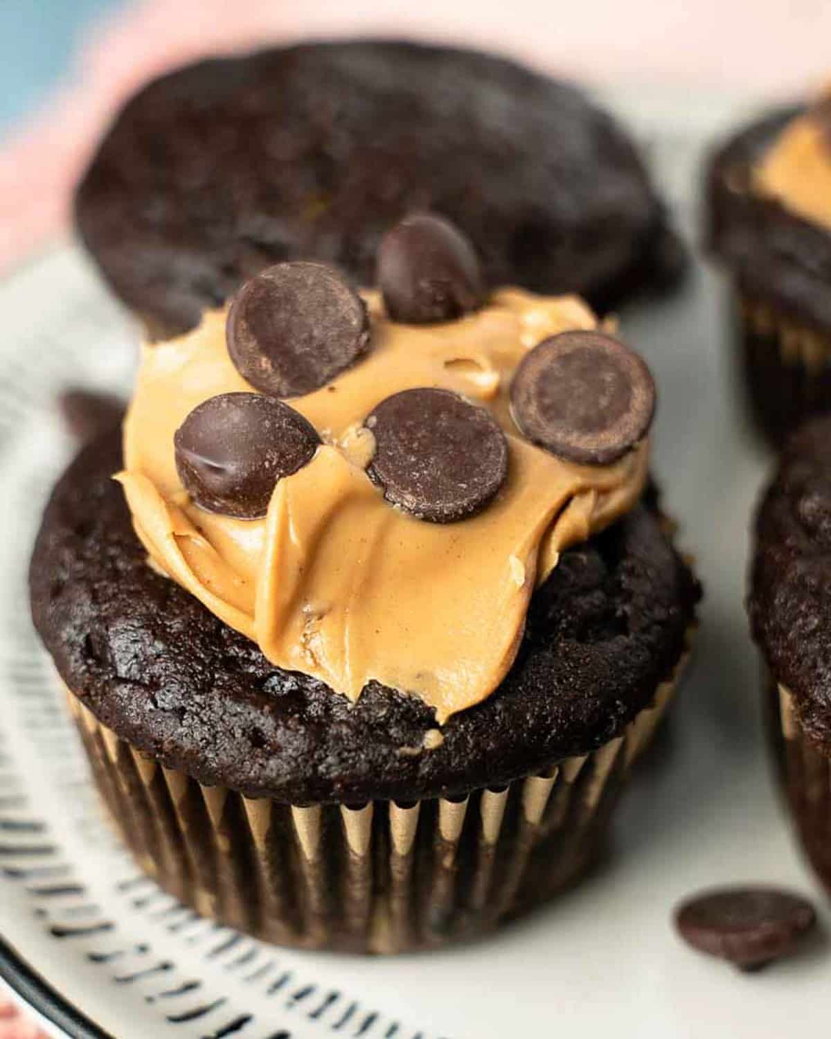 a chocolate muffin with peanut butter and chocolate chips on top