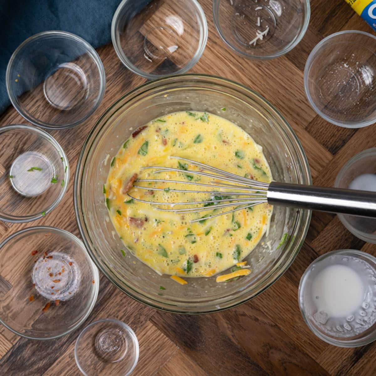 whisked egg mixture for souffle in a glass bowl