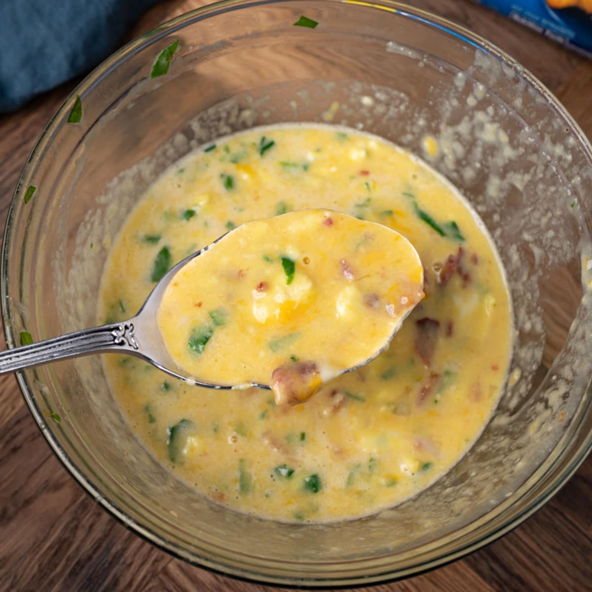 egg mixture in a bowl with a spoon