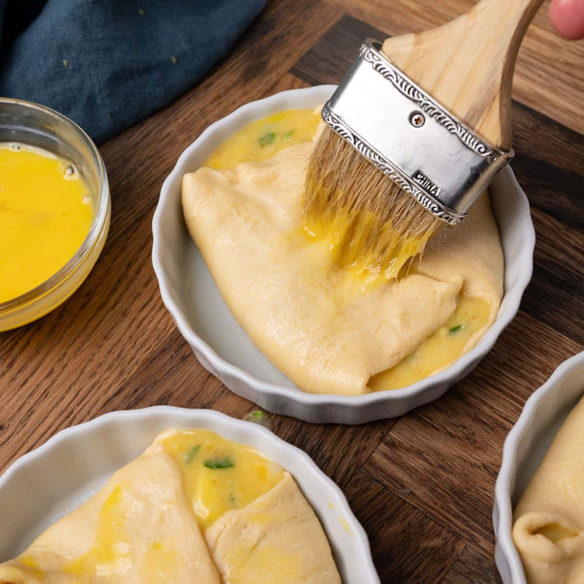 brushing egg white over unbaked egg souffle