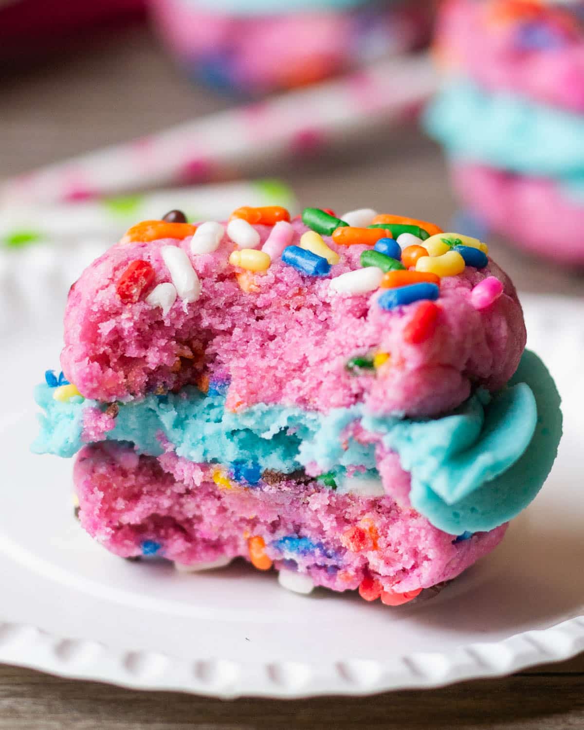 half of a funfetti cookie sandwich on a plate