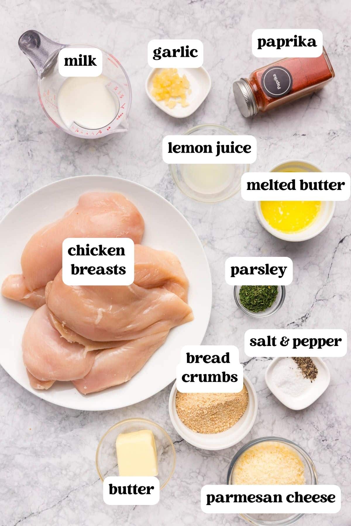ingredients for garlic butter parmesan chicken on a table