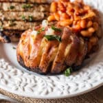 closeup of grilled hasselback potatoes on a plate