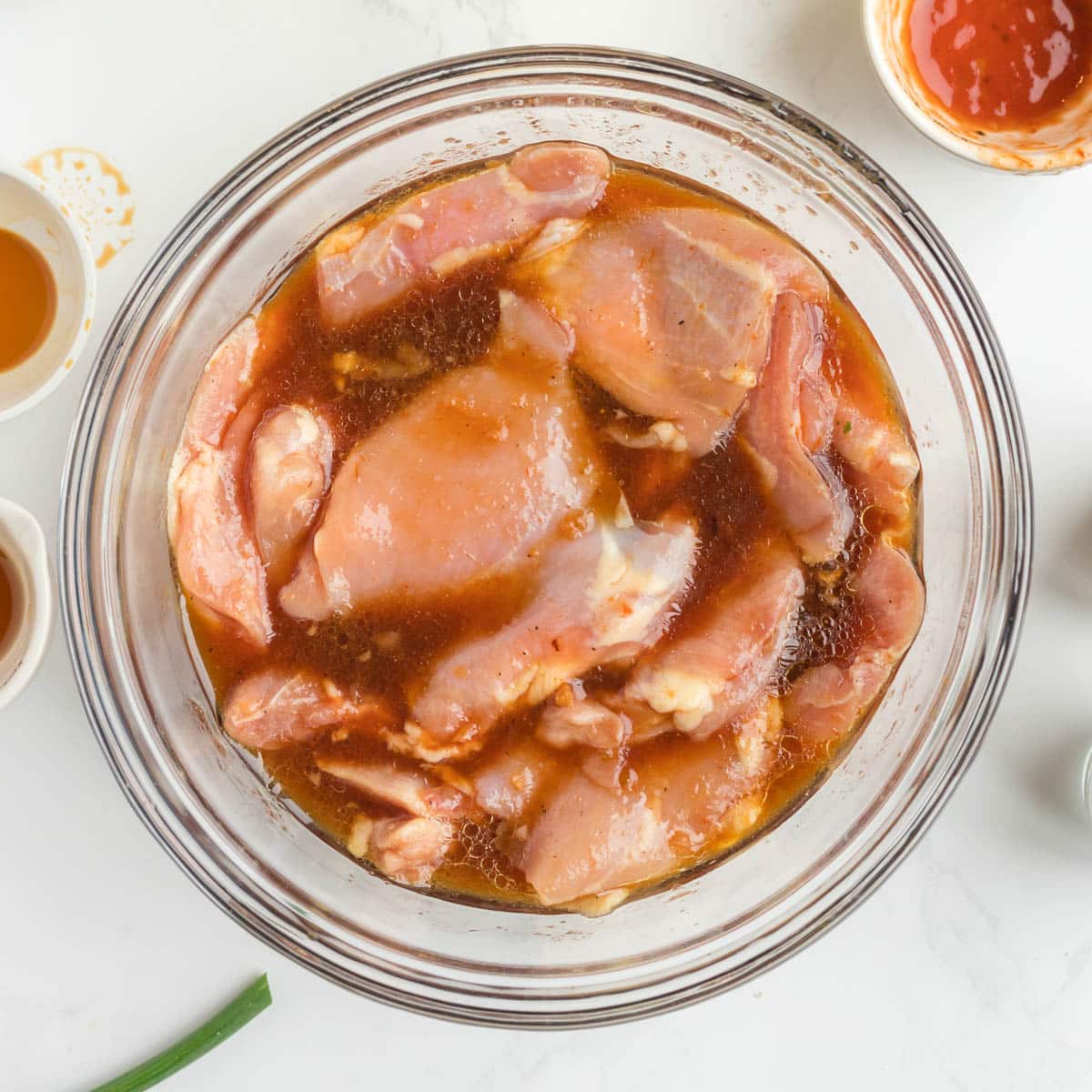 overhead view of chicken marinating in hawaiian bbq sauce