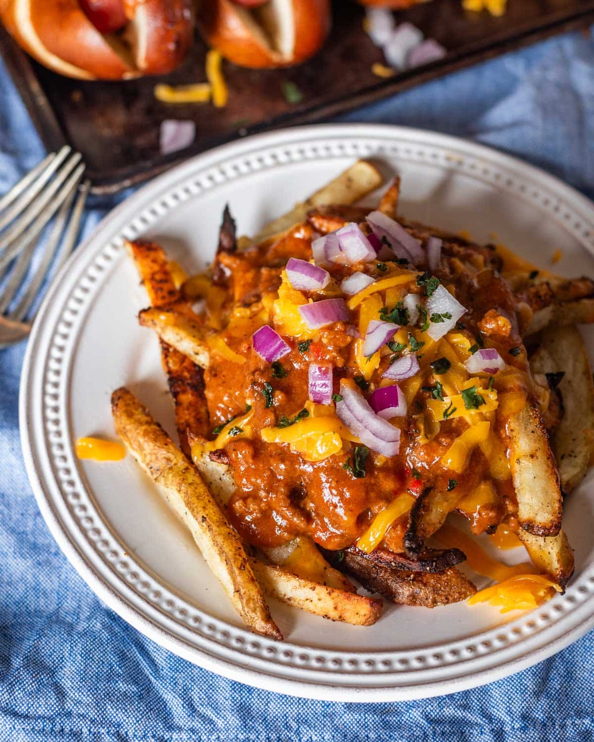 loaded french fries with chili sauce and cheese