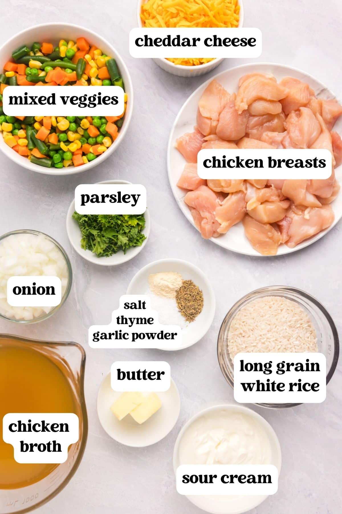 Ingredients for creamy chicken and rice on a table