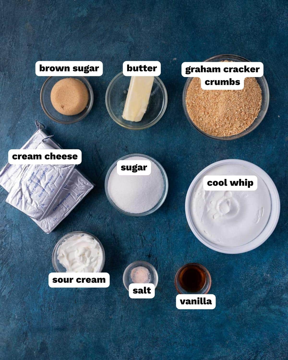 ingredients for no bake cheesecake bars on a table