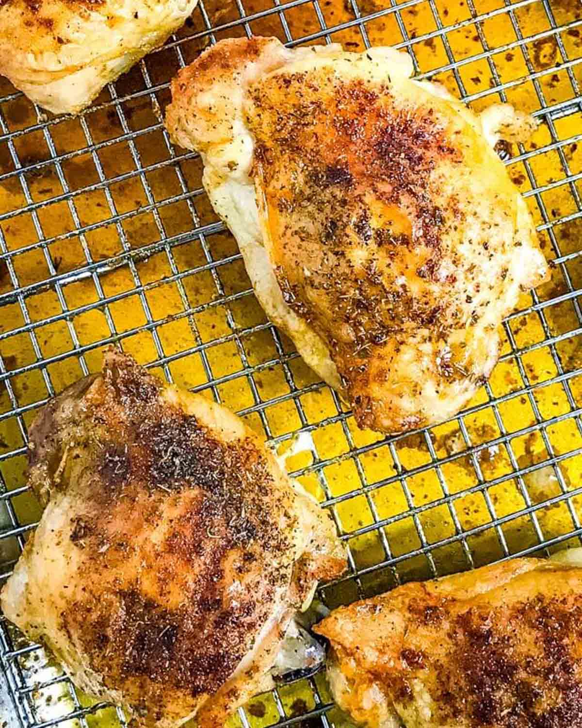 baked chicken thighs on a rack