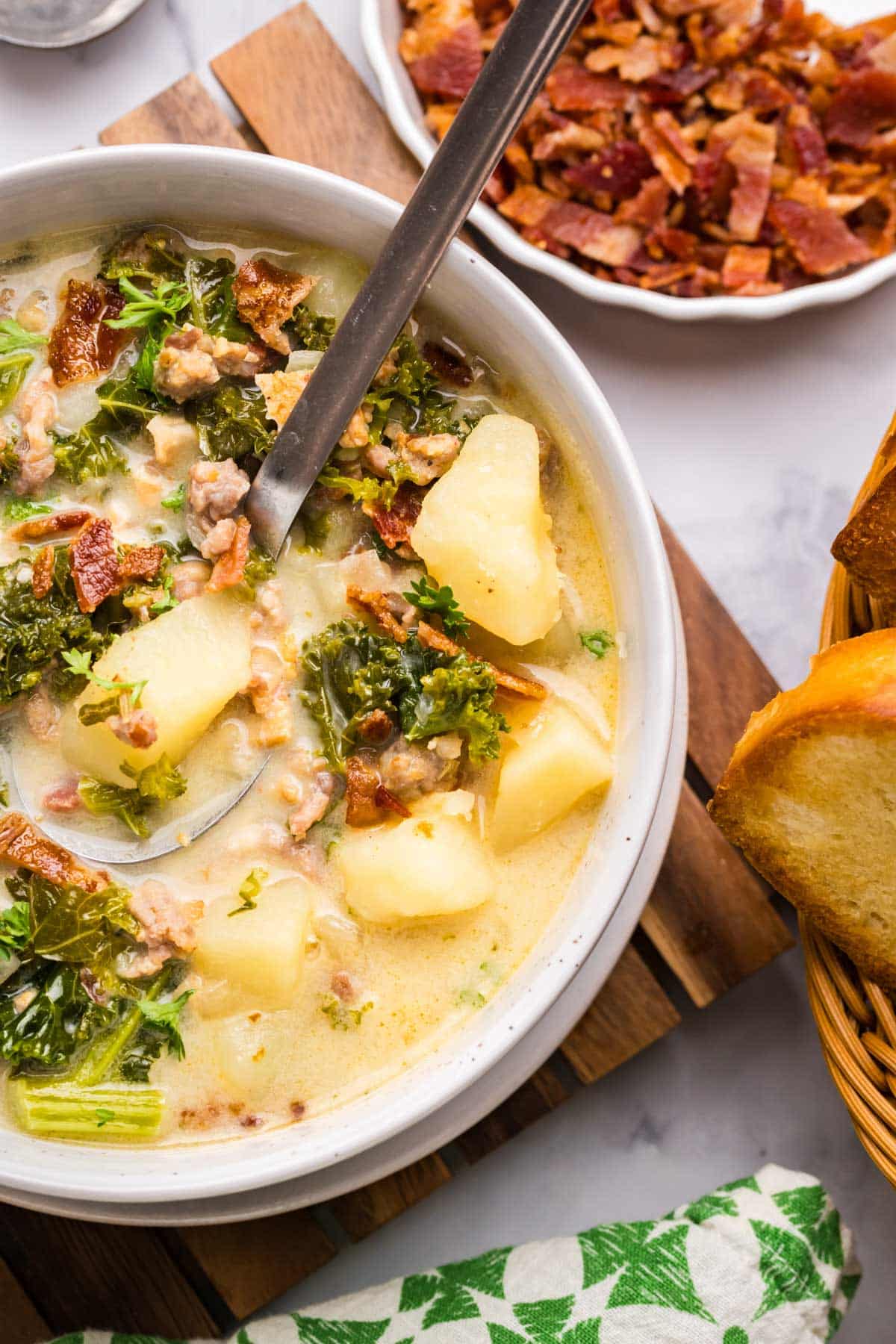 closeup of a bowl of zuppa toscana on a table