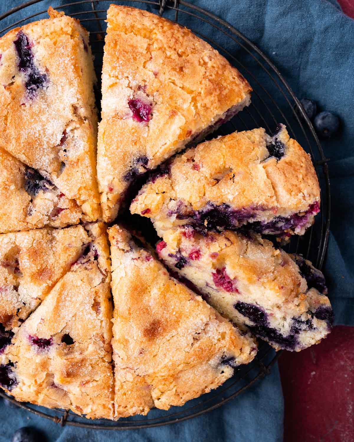 overhead view of a raspberry blueberry cake sliced