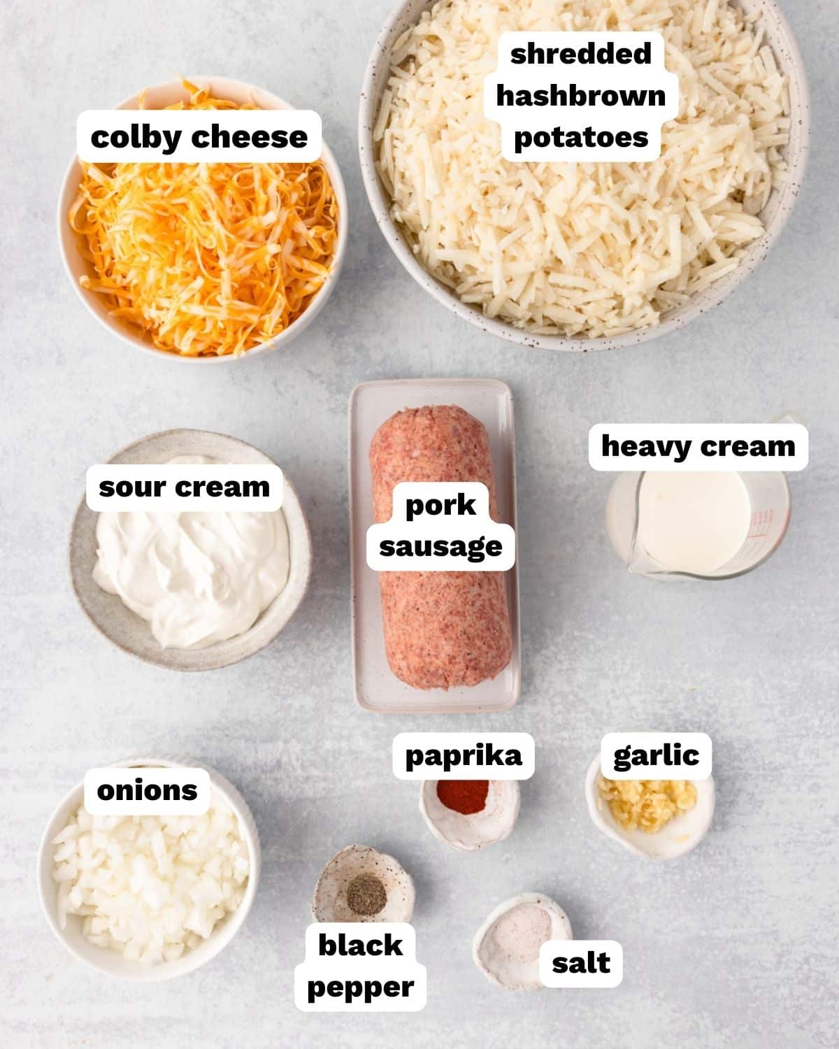 ingredients for sausage hash brown casserole on a table