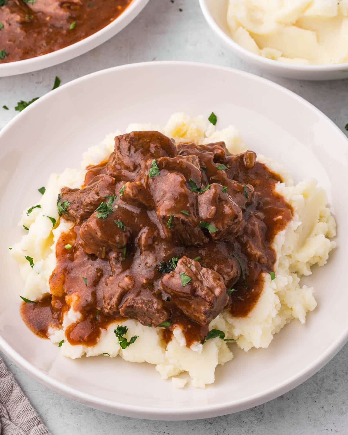 beef tips with gravy over mashed potatoes