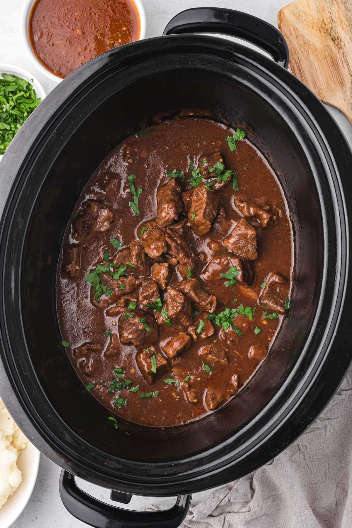 overhead view of slow cooker beef tips and gravy