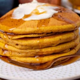 closeup of sourdough pumpkin pancakes on a plate